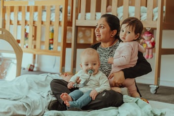 An educator with two very young children